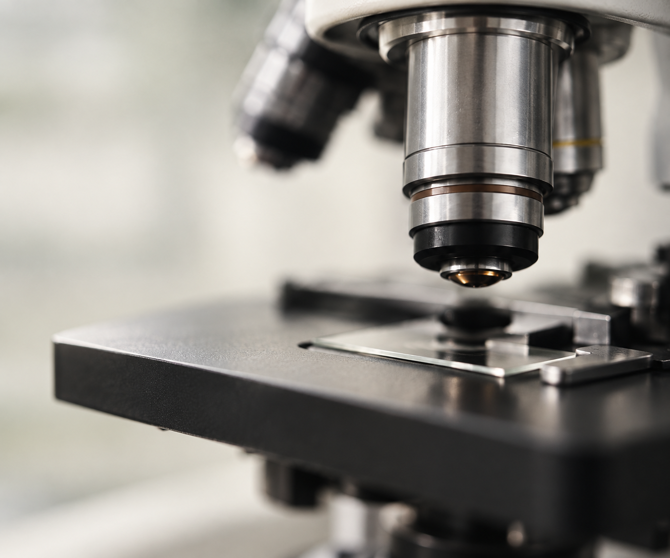 Close-up of a laboratory microscope behind guidance on how to read a research study.